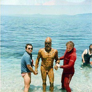 One of the bronzes with divers who brought it out of the sea.